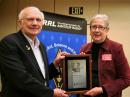 ARRL President Kay Craigie, N3KN, presents the ARRL President's Award plaque to League CEO David Sumner, K1ZZ. [Rick Lindquist, WW1ME, photo]